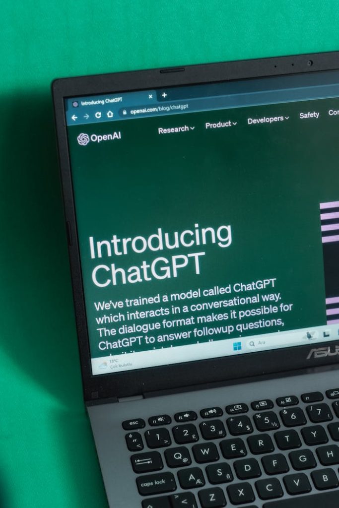 Laptop screen displaying the introductory page of ChatGPT on OpenAIs website.